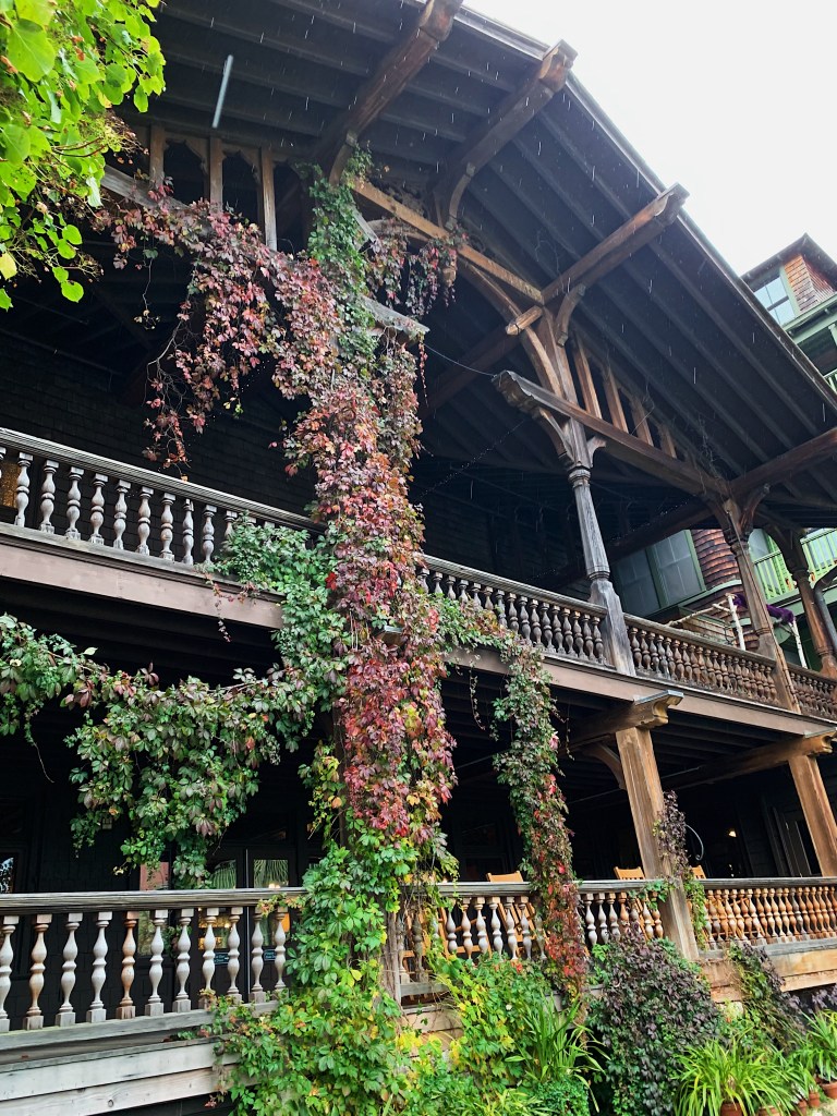 victorian style deck covered in ivy