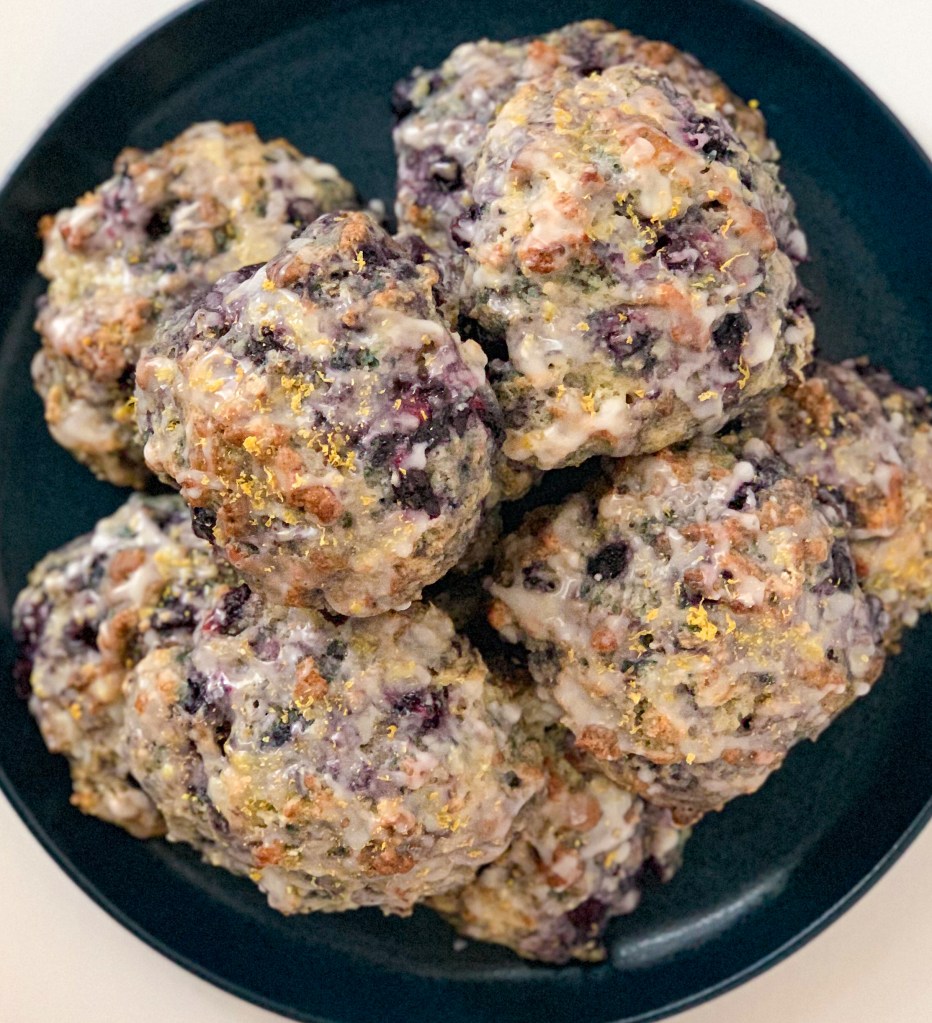 Pile of  glazed scones sprinkled with lemon zest