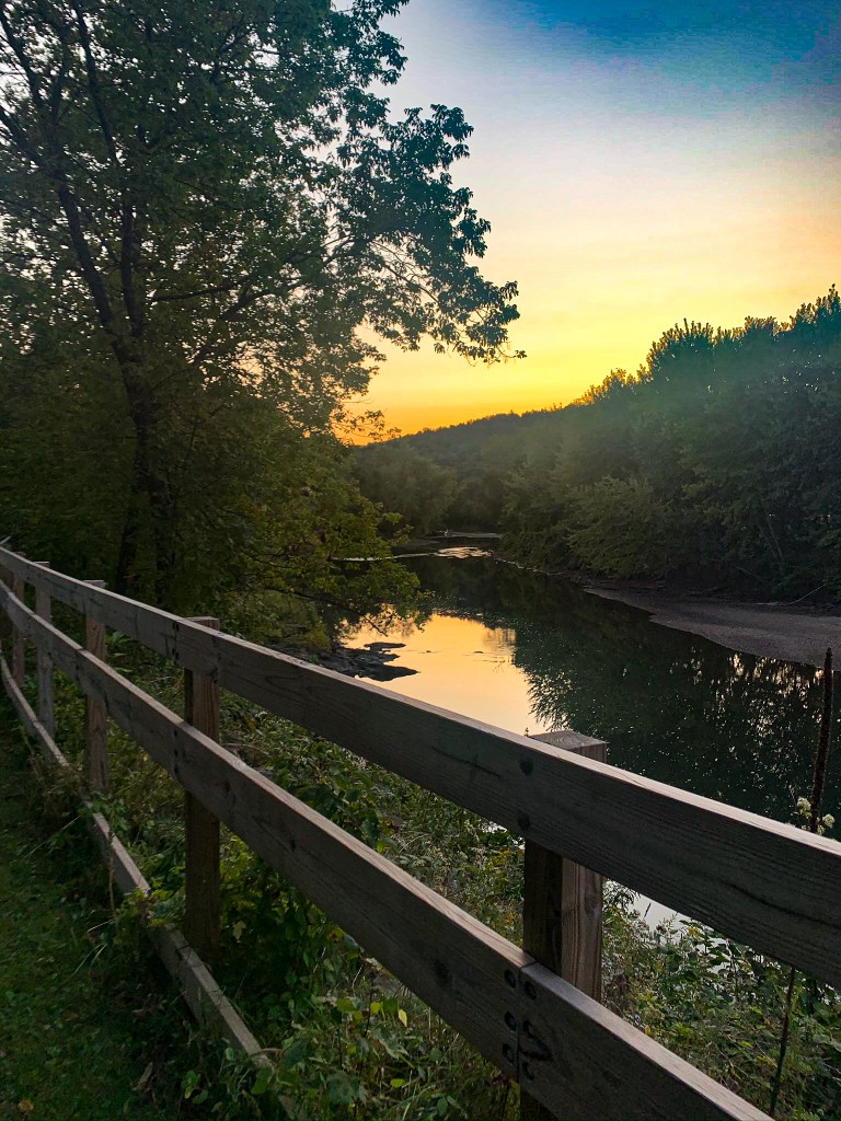 View of the slow moving river at sunset