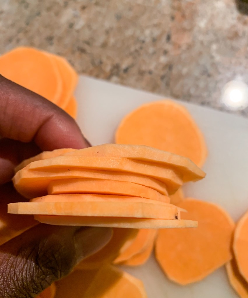 Peel and thinly slice the sweet potato
